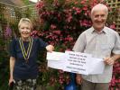 President of Filey Rotary presents a cheque to enable sixty-five children to be educated